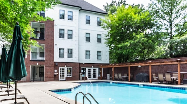 3275 Lenox Rd NE Unit 413, Atlanta, GA 30324 - community pool featuring french doors and a patio