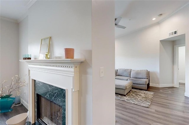 3275 Lenox Rd NE Unit 413, Atlanta, GA 30324 - living room featuring wood finished floors, ornamental molding, a fireplace, and recessed lighting