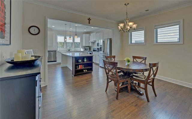 5638 Maple Bluff Way, Hoschton, GA 30548 - dining space featuring crown molding, dark wood-type flooring, baseboards, a chandelier, and recessed lighting