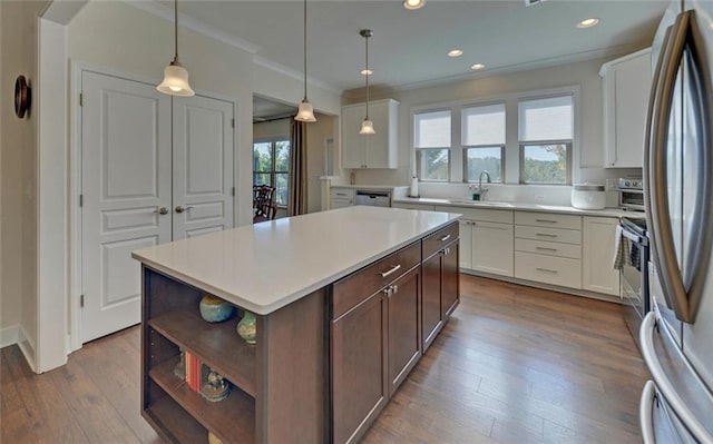5638 Maple Bluff Way, Hoschton, GA 30548 - kitchen with open shelves, light countertops, stainless steel appliances, white cabinetry, and a sink