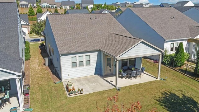 5638 Maple Bluff Way, Hoschton, GA 30548 - back of house with fence, a patio area, a lawn, and a shingled roof