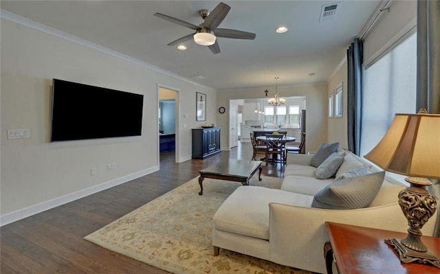 5638 Maple Bluff Way, Hoschton, GA 30548 - living room with visible vents, baseboards, ornamental molding, ceiling fan with notable chandelier, and wood finished floors
