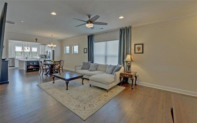 5638 Maple Bluff Way, Hoschton, GA 30548 - living area with dark wood-type flooring, ceiling fan with notable chandelier, recessed lighting, crown molding, and baseboards