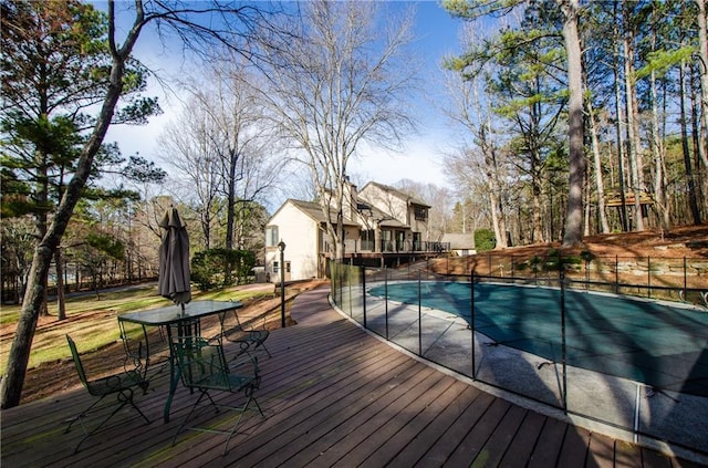 view of pool featuring a fenced in pool and a wooden deck