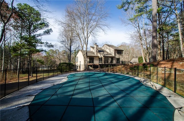 view of swimming pool with fence and a fenced in pool