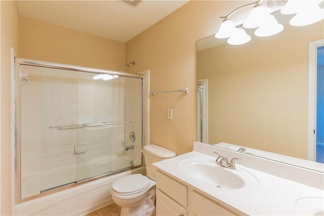 bathroom with toilet, shower / bath combination with glass door, visible vents, and vanity