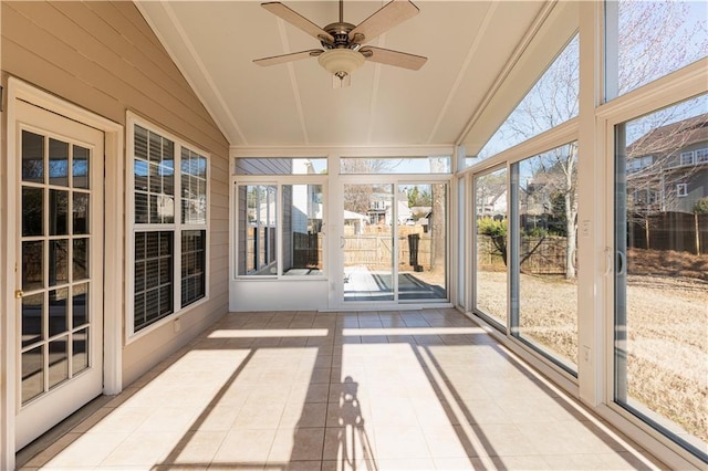 unfurnished sunroom with lofted ceiling and ceiling fan