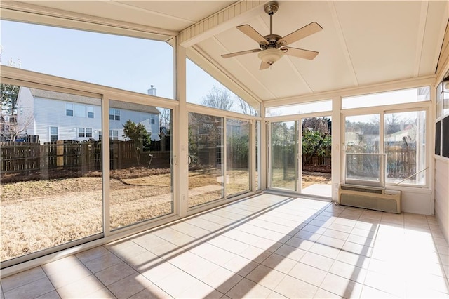 unfurnished sunroom featuring an AC wall unit, ceiling fan, and lofted ceiling with beams