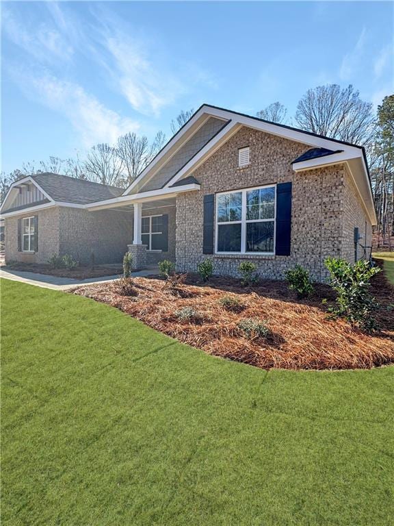 view of front of home with a front yard