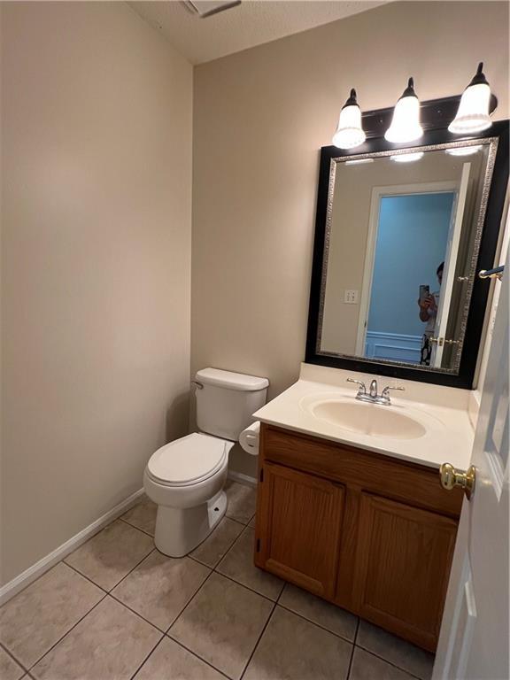 11800 Carriage Park Ln, Johns Creek, GA 30097 - bathroom with vanity and tile patterned flooring
