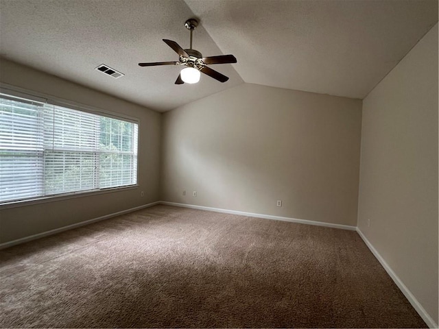 11800 Carriage Park Ln, Johns Creek, GA 30097 - carpeted spare room featuring ceiling fan, lofted ceiling, and a textured ceiling