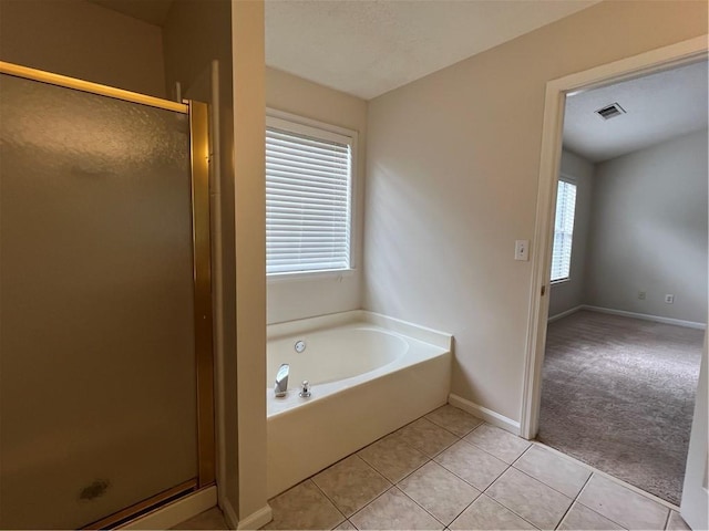 11800 Carriage Park Ln, Johns Creek, GA 30097 - bathroom with a shower stall, a bath, and tile patterned floors