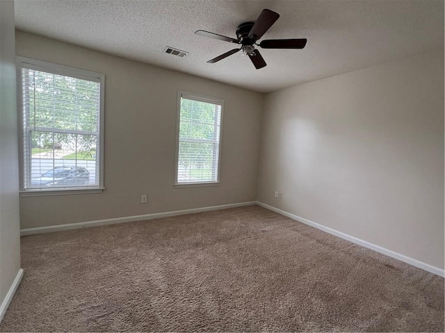 11800 Carriage Park Ln, Johns Creek, GA 30097 - unfurnished room featuring a textured ceiling, a ceiling fan, and carpet flooring
