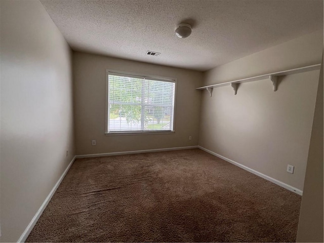 11800 Carriage Park Ln, Johns Creek, GA 30097 - carpeted spare room featuring a textured ceiling and baseboards