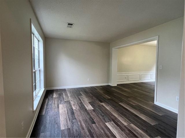 11800 Carriage Park Ln, Johns Creek, GA 30097 - empty room featuring dark wood finished floors and a textured ceiling