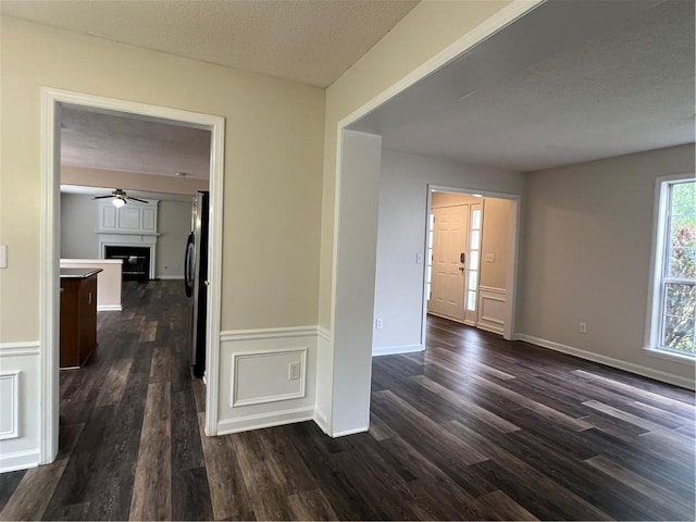 11800 Carriage Park Ln, Johns Creek, GA 30097 - hallway featuring dark wood-style floors and a textured ceiling