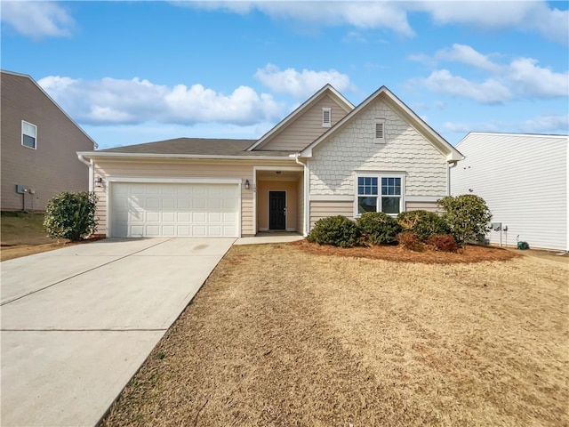 view of front of house with a garage and concrete driveway