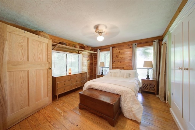 1066 Sea Oats Way SW, Lilburn, GA 30047 - bedroom with a textured ceiling, light wood-type flooring, and a ceiling fan
