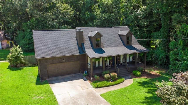 1066 Sea Oats Way SW, Lilburn, GA 30047 - view of front of property featuring covered porch, concrete driveway, roof with shingles, and a garage