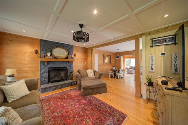 1066 Sea Oats Way SW, Lilburn, GA 30047 - living room featuring coffered ceiling, wood walls, a fireplace, light wood finished floors, and recessed lighting