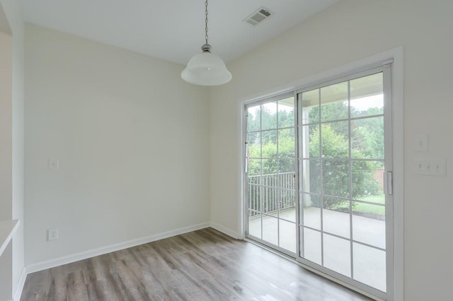 502 Helene Ct, Woodstock, GA 30188 - unfurnished dining area with wood finished floors and baseboards