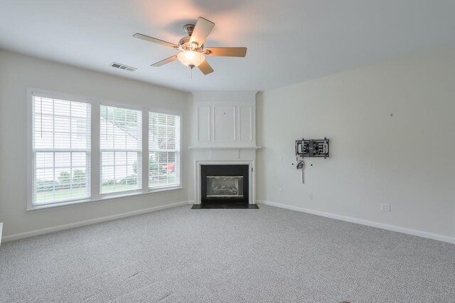 502 Helene Ct, Woodstock, GA 30188 - unfurnished living room featuring a large fireplace, a ceiling fan, and baseboards