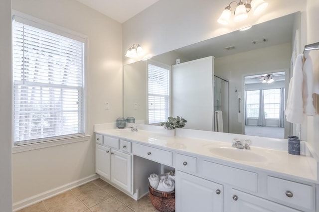502 Helene Ct, Woodstock, GA 30188 - full bathroom featuring double vanity, tile patterned floors, a shower with door, baseboards, and a ceiling fan