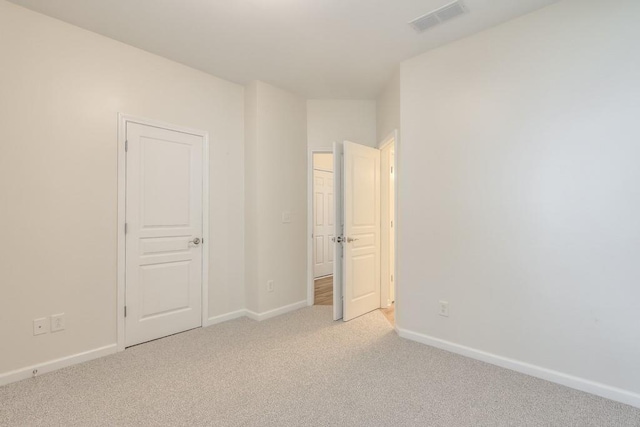 502 Helene Ct, Woodstock, GA 30188 - unfurnished bedroom featuring light carpet and baseboards
