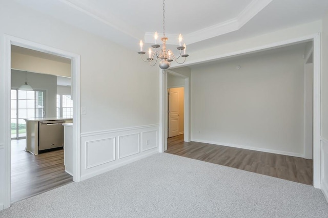 502 Helene Ct, Woodstock, GA 30188 - carpeted spare room with a chandelier, crown molding, wood finished floors, a wainscoted wall, and a tray ceiling