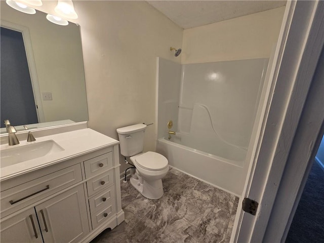 bathroom featuring  shower combination, vanity, and toilet