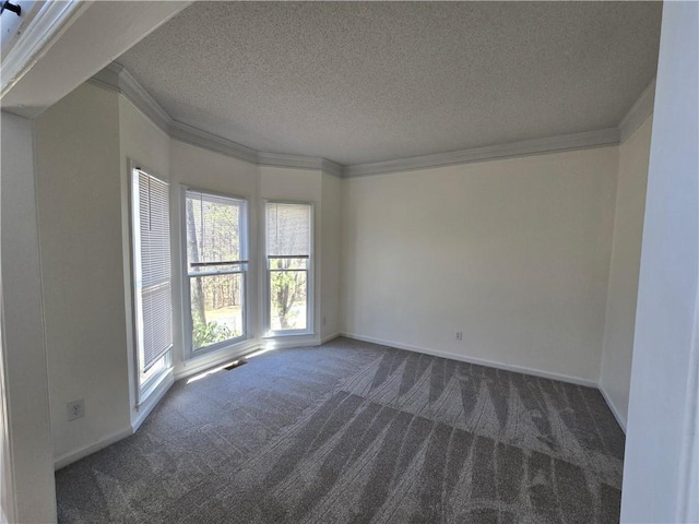 carpeted empty room featuring a textured ceiling, ornamental molding, and baseboards