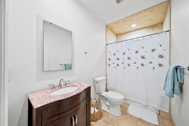 bathroom with vanity, tile patterned floors, toilet, and a shower with shower curtain