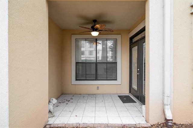 entrance to property featuring ceiling fan