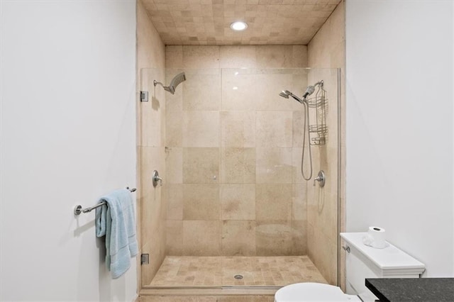 bathroom with toilet and walk in shower