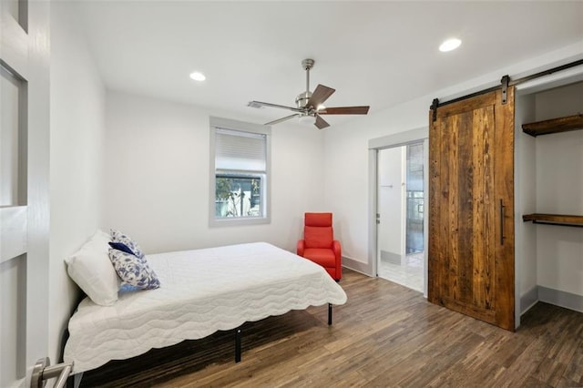 bedroom with recessed lighting, baseboards, and wood finished floors