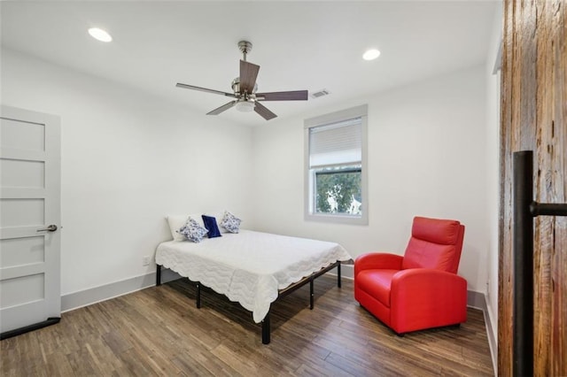 bedroom with recessed lighting, wood finished floors, visible vents, and baseboards