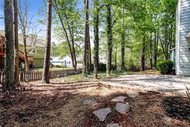 view of yard featuring a patio and fence