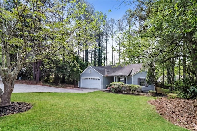 view of front of home with a garage, driveway, and a front lawn