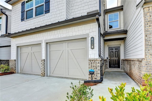 view of exterior entry with a garage