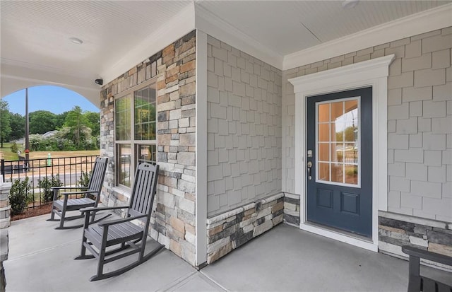 doorway to property with covered porch