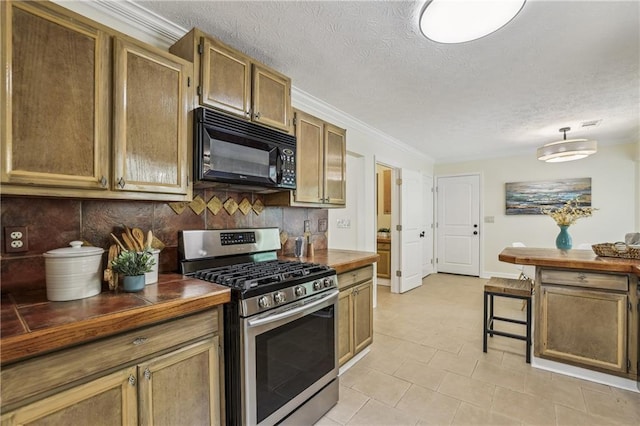 255 Broken Lance Pl, Johns Creek, GA 30022 - kitchen featuring black microwave, stainless steel gas stove, backsplash, a textured ceiling, and tile counters