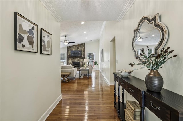 255 Broken Lance Pl, Johns Creek, GA 30022 - hall with a textured ceiling, crown molding, lofted ceiling, dark wood-type flooring, and baseboards