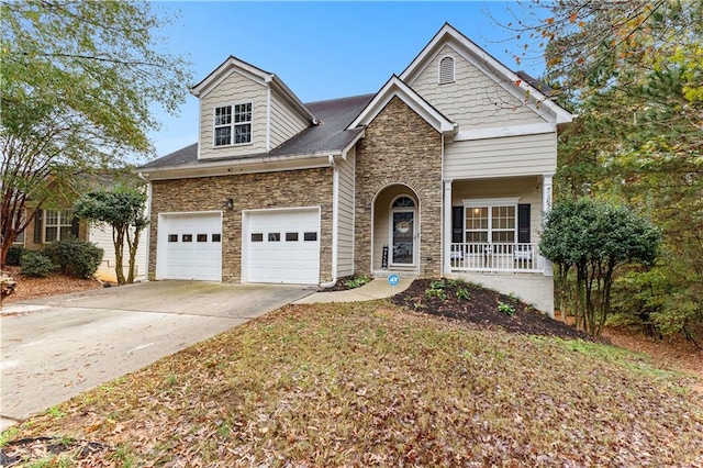 view of front of property featuring a porch and a garage