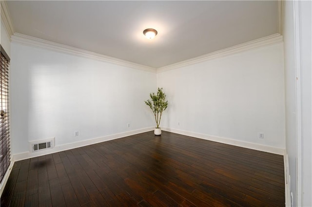 empty room with crown molding, baseboards, visible vents, and dark wood-style flooring