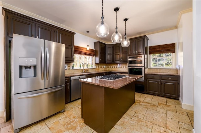 kitchen featuring a sink, stainless steel appliances, dark brown cabinets, and stone tile flooring