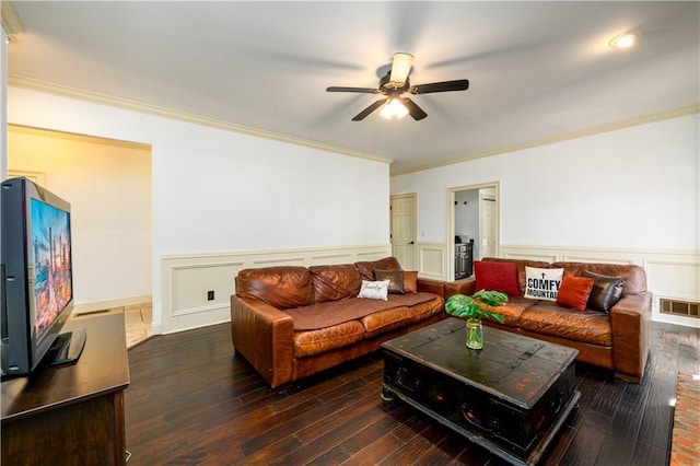 living room featuring visible vents, ornamental molding, ceiling fan, and dark wood-type flooring