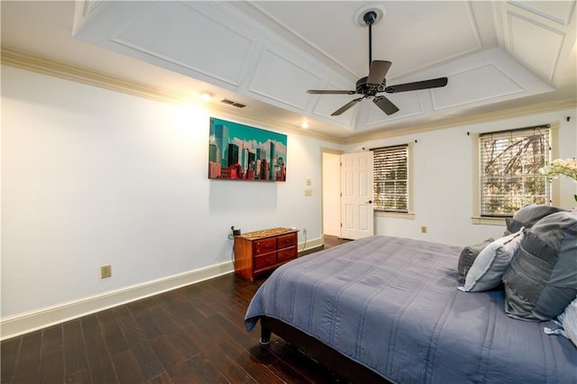 bedroom featuring wood finished floors, baseboards, visible vents, coffered ceiling, and crown molding