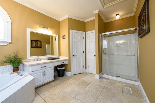 bathroom with a stall shower, vanity, ornamental molding, and a garden tub