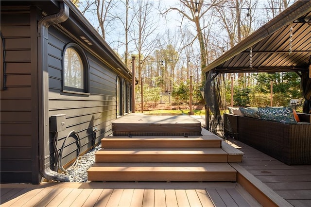 wooden deck with an outdoor hangout area