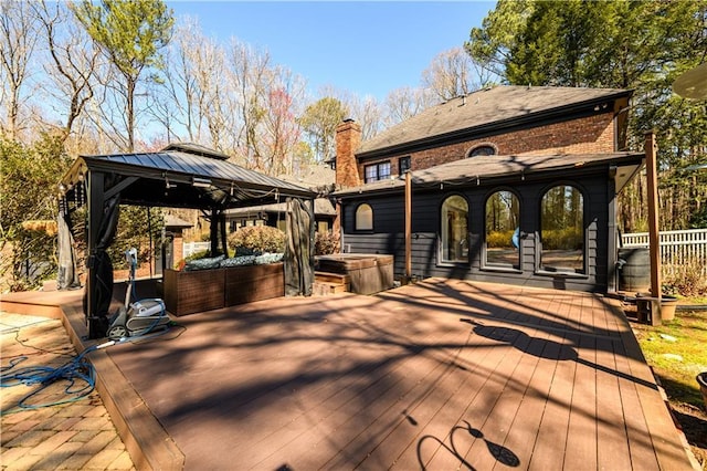 wooden deck featuring a gazebo